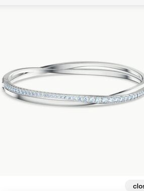 Swarovski Twist Rhodium Plated Silver Toned Bracelet With Blue Crystsls Small